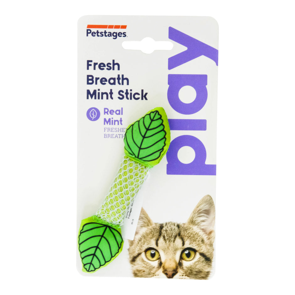 Petstages Fresh Breath Mint Stick cat chew toy in retail packaging, showing the mesh stick with green leaf-shaped crinkle ends, alongside a tabby cat.