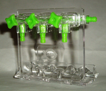 Unipet clear acrylic 3-way aquarium gang valve divider with green control knobs and outlet barbs, shown on a stand