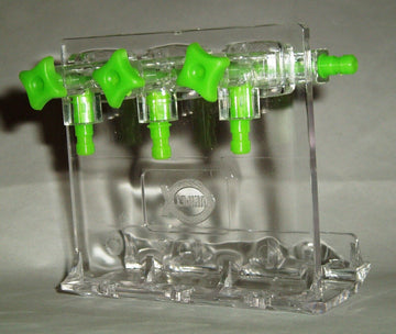 Unipet clear aquarium gang valve divider with green control knobs and outlet barbs, shown on its stand
