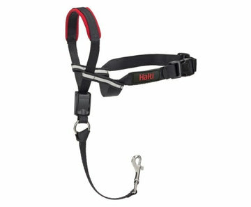 Halti OptiFit Headcollar laid flat on white background, showing black and red straps, reflective cheek straps, chin strap buckle, and included safety link clip