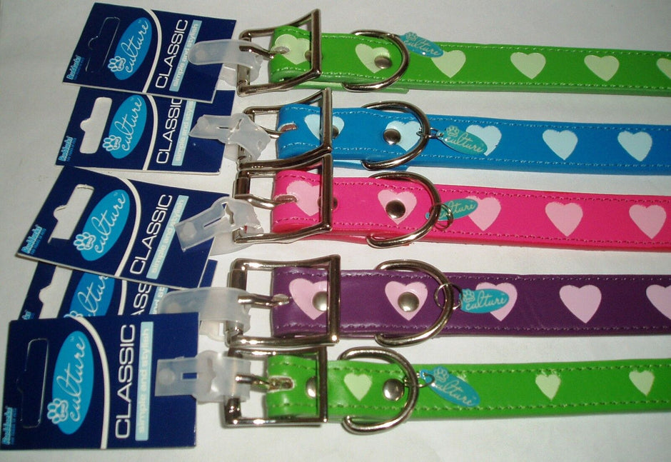 Five Rudducks Paw Culture Hearts dog collars laid out in green, blue, pink, purple, and green, each showing a heart print pattern, metal buckle, and D-ring, displayed on their retail card packaging.