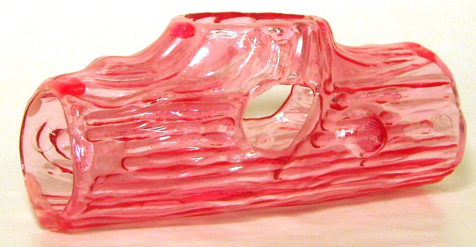 Unipet Play Log plastic toy in translucent pink, showing log-shaped body with tunnel openings, side view