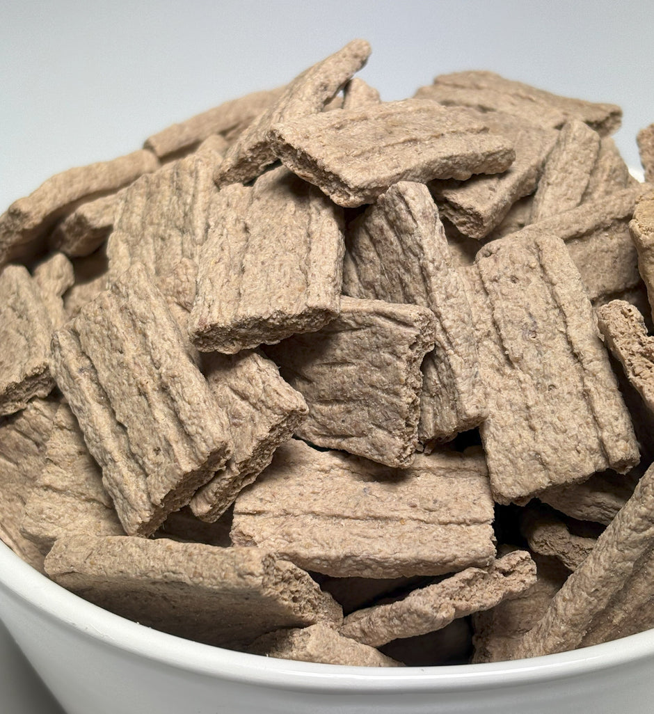 Bowl filled with GoPetPlace chicken BBQ crinkle chips dog treats