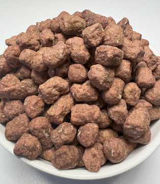 Large pile of GoPetPlace kangaroo meatball dog treats on a white plate, showing the full 1kg quantity
