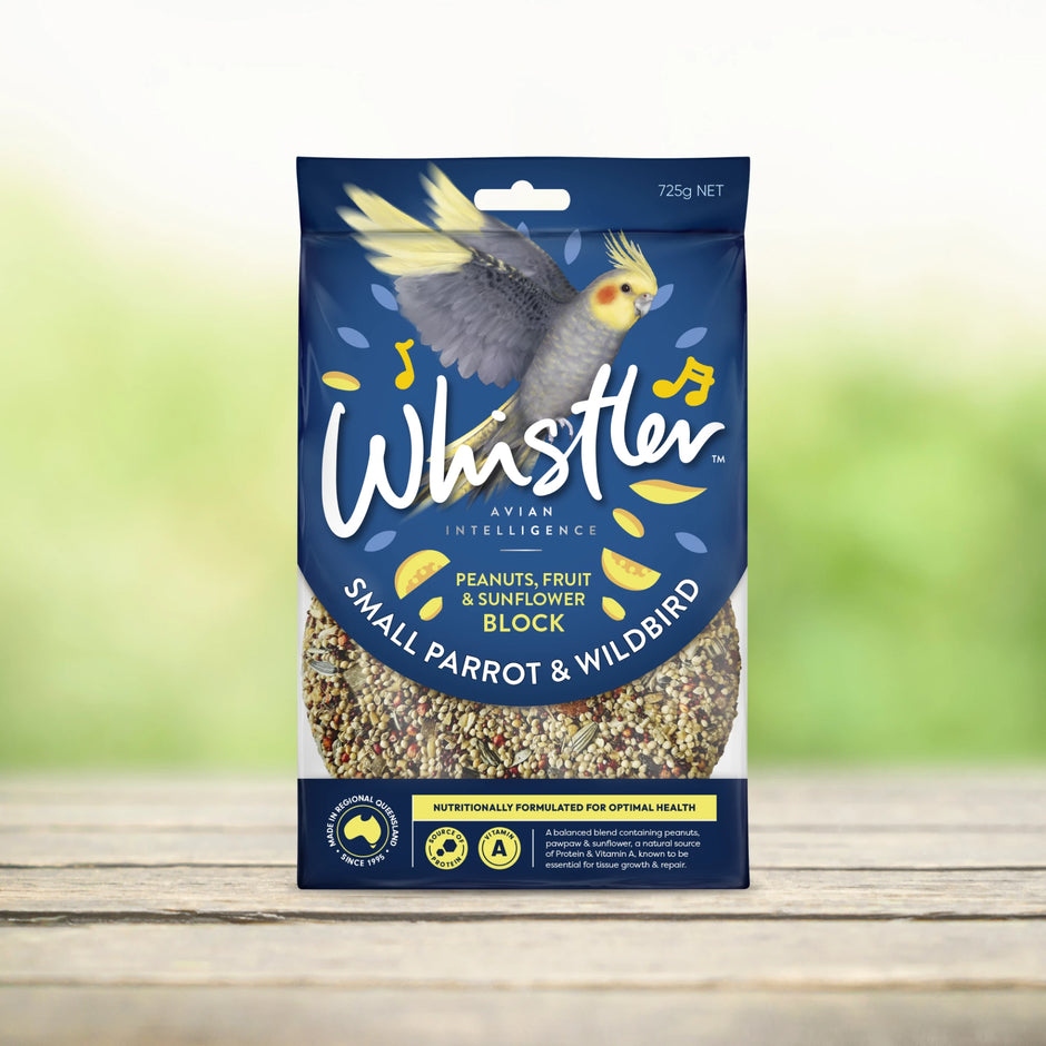 Front of Whistler Small Parrot & Wildbird Peanuts, Fruit & Sunflower Seed Block 725g package, featuring a cockatiel illustration on a navy blue background with the seed block visible at the base of the pack.