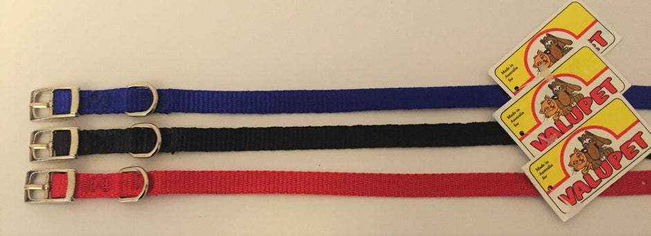 Kramar nylon dog collars in blue, black and red laid flat, each with a silver buckle and D-ring, shown with Valupet swing tags.