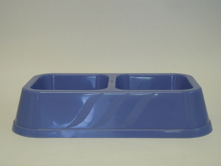 Stylette double-sided plastic pet bowl in pale blue, showing two square wells side by side with a ribbed exterior detail.