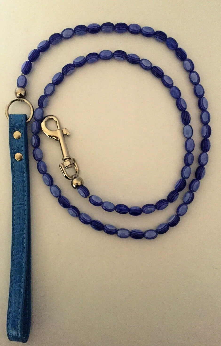 GoPetPlace 120cm fancy beaded dog lead in blue, coiled to show the full length, with a silver clip and a flat blue handle.