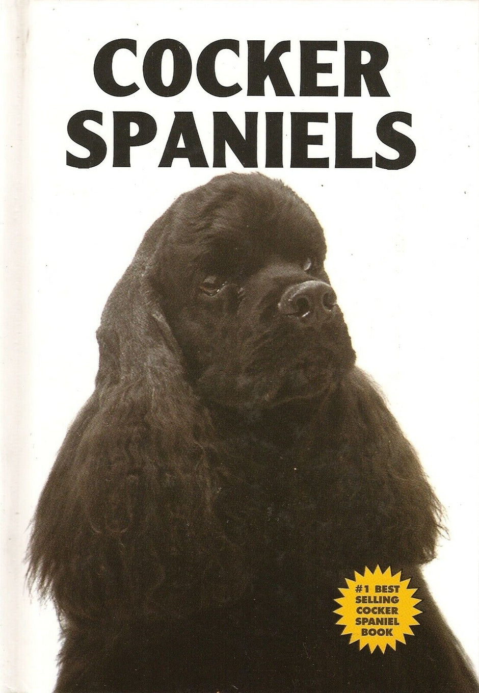 Front cover of Cocker Spaniels by Bart King, featuring a black Cocker Spaniel on a white background