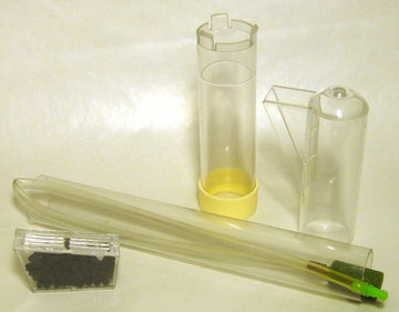 Components of the undergravel filter replacement uplift pack laid out flat: uplift tube with yellow base ring, exhaust fitting, airline tube with air stone, and disposable carbon cartridge in a plastic case.