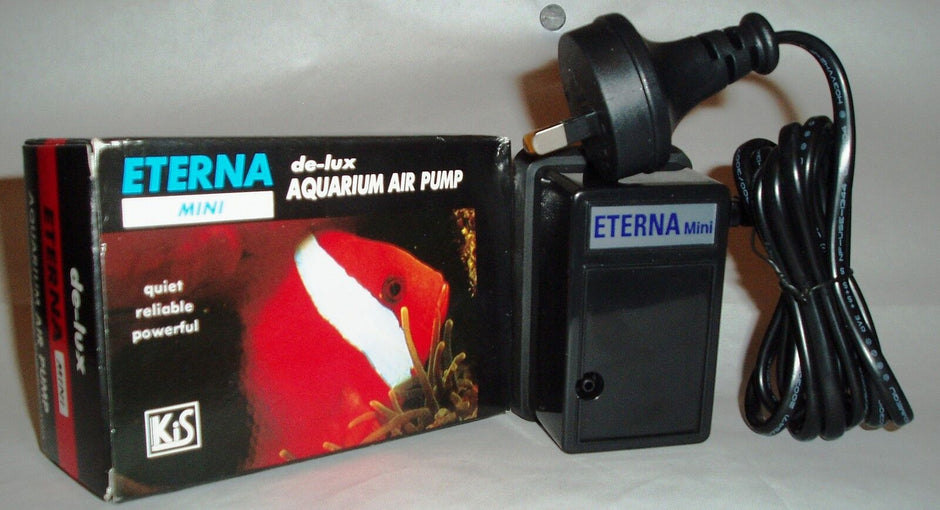 Eterna Mini aquarium air pump beside its retail box, showing the compact black pump unit with Australian plug and power cord