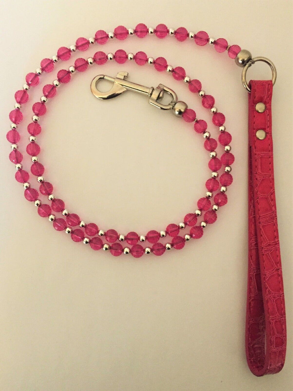 GoPetPlace 120cm beaded dog lead in pink, showing pink and silver beads strung on wire with a metal clip and pink textured loop handle