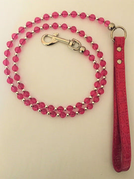 GoPetPlace 120cm beaded dog lead in pink, showing pink and silver beads strung on wire with a metal clip and pink textured loop handle