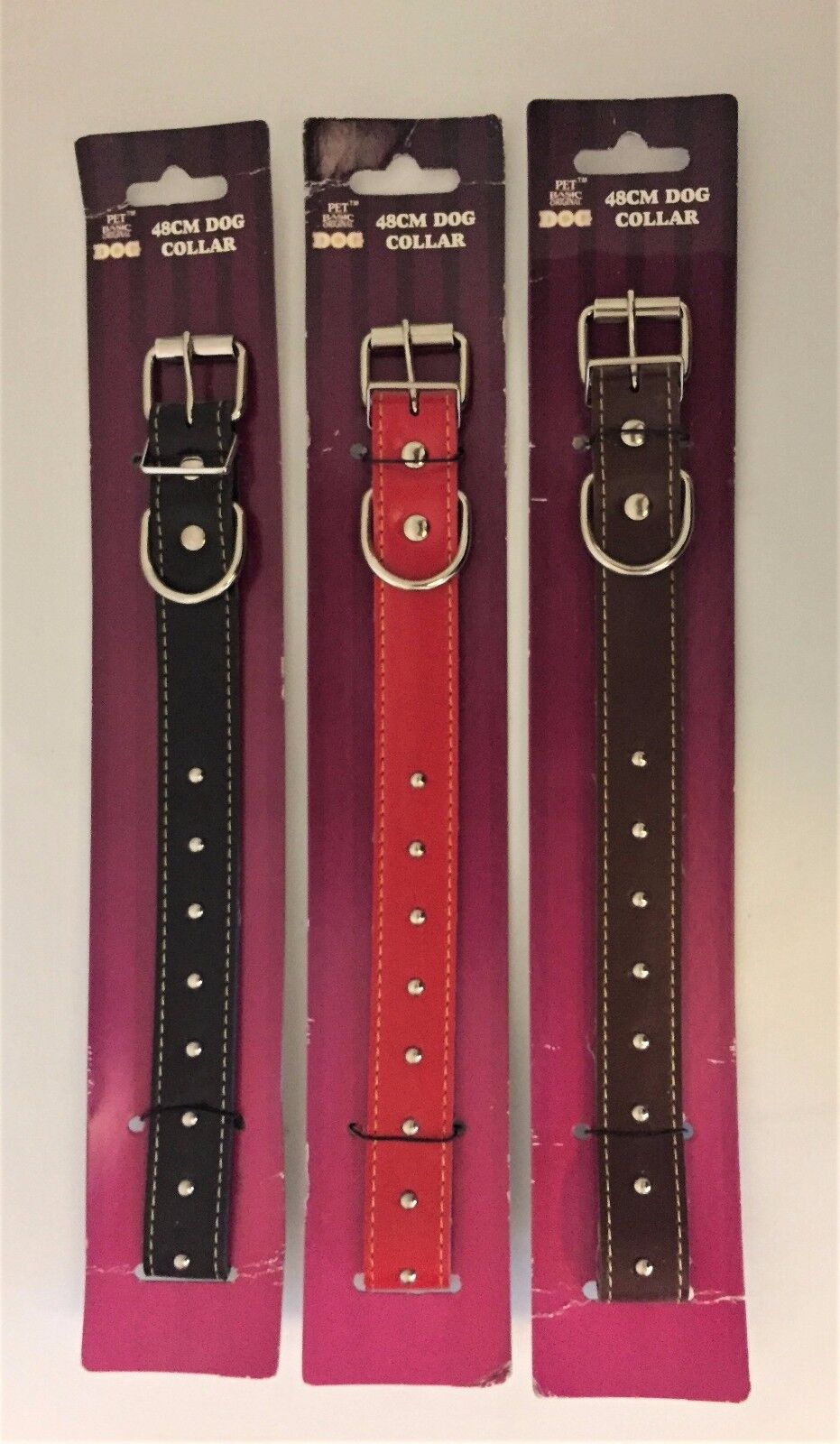 Pet Basic 48cm studded dog collars in black, red and brown, shown in packaging with silver buckles and dome studs.